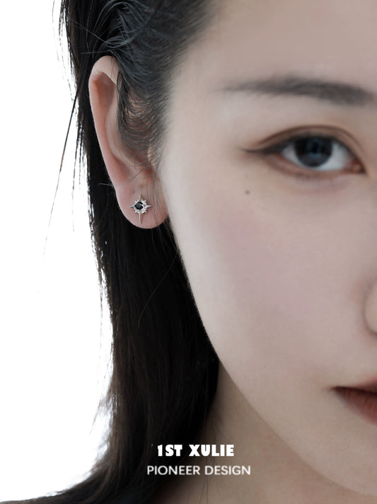 Chic model wearing 1STXULIE cosmic star earrings that add a stylish touch to any outfit