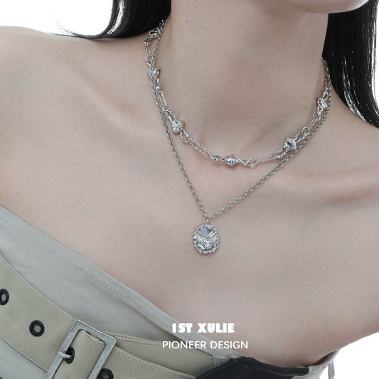 Elegant crowned cat necklace layered with silver chains for a stylish accessory look
