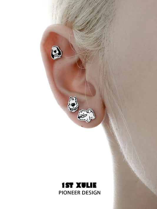 Cute puppy earrings featuring playful designs of dogs in various poses by 1STXULIE