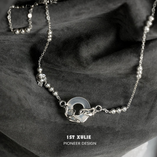 Elegant eternal rings silver necklace by 1STXULIE featuring a unique design with beads and a circular pendant