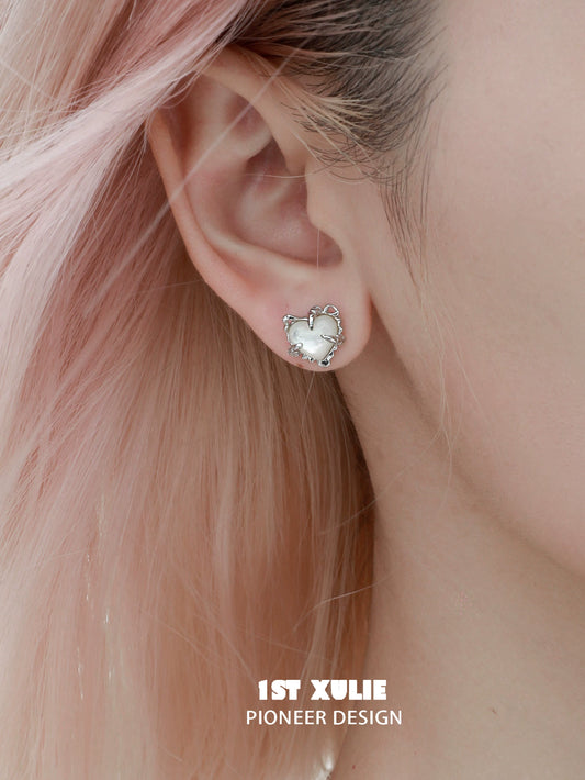 Heart ear clips for women designed by 1ST XULIE with a charming silver finish