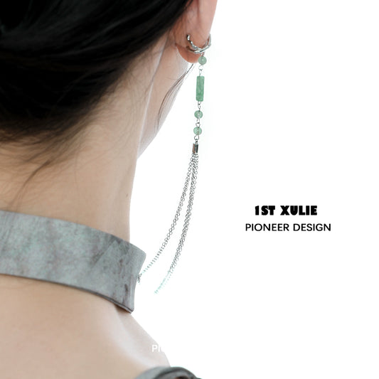 Stylish jade cascade ear clip with delicate chains, perfect for modern jewelry lovers