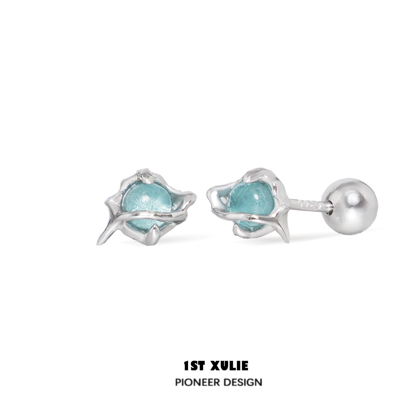 Stylish ocean blue stud earrings featuring a unique design with silver accents
