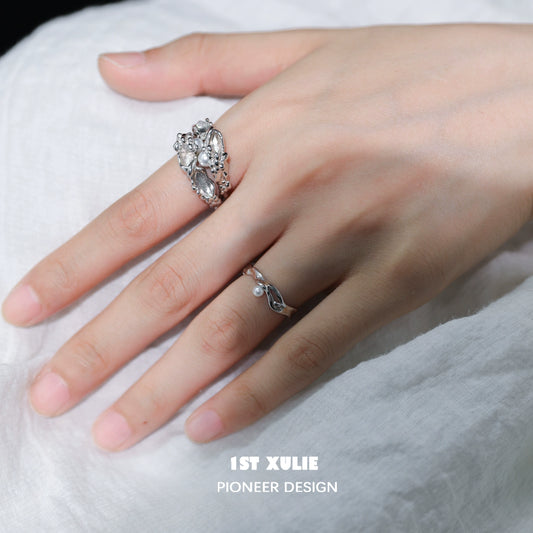 Elegant pearl silver ring from 1STXULIE displayed on a model's hand with intricate detailing