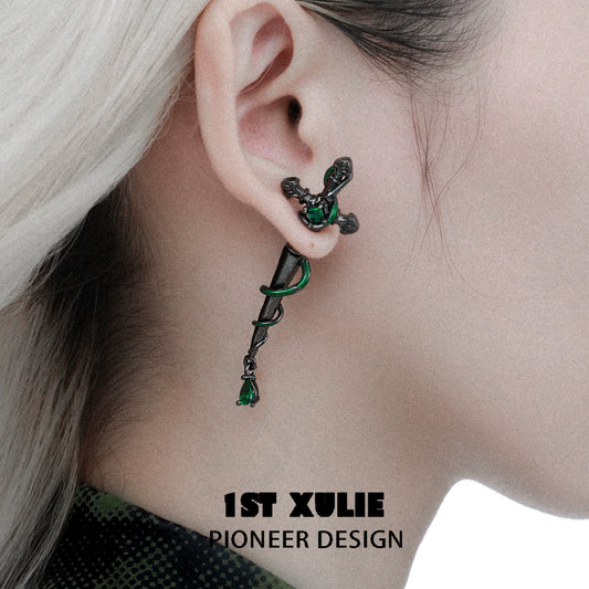 Slytherin inspired cross earrings with intricate design and green accents for stylish fans