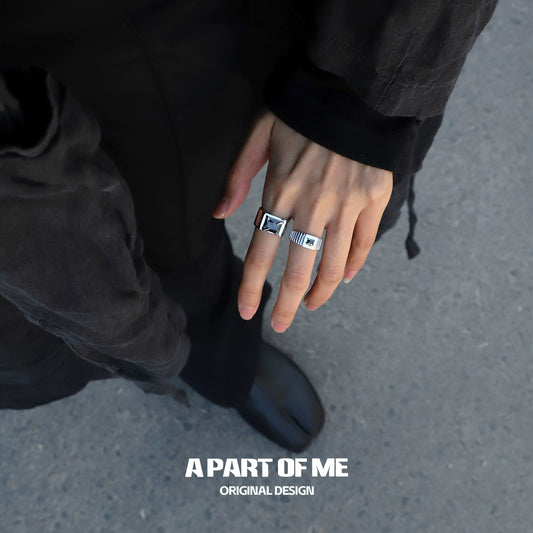 Bold stone hip-hop ring displayed on a person's hand, showcasing its unique design and style.