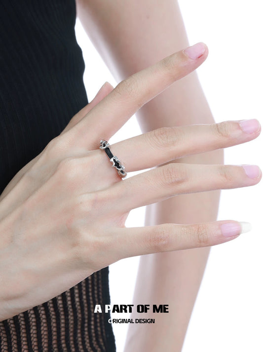 Elegant A PART OF ME dark matter ring displayed on a hand with a minimalist design