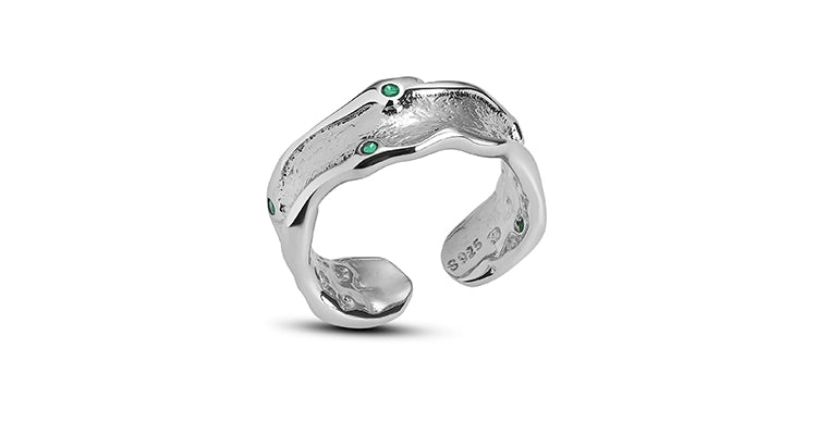A PART OF ME green crown punk ring featuring a unique twisted design with green gemstones