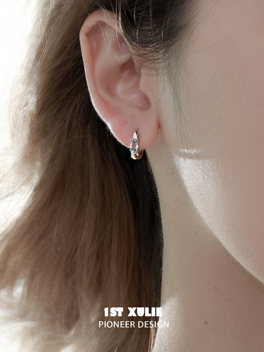 Elegant silver hoop earrings featuring blue cosmic earrings, perfect for any occasion