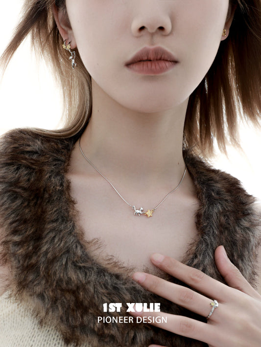 Elegant 1STXULIE cat star clavicle necklace on model with a chic outfit