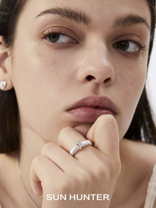 Elegant model wearing a SUN HUNTER French retro lock ring on her finger, showcasing its delicate design.