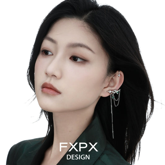 Elegant model wearing FXPX forest star ear cuff with delicate chain detail for a stylish look