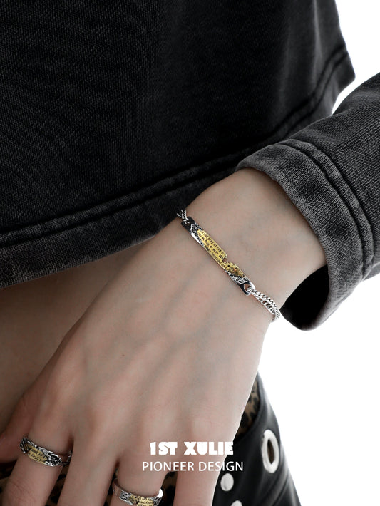 Stylish 1STXULIE immortal love letter couple bracelet on a person's wrist, showcasing its unique design