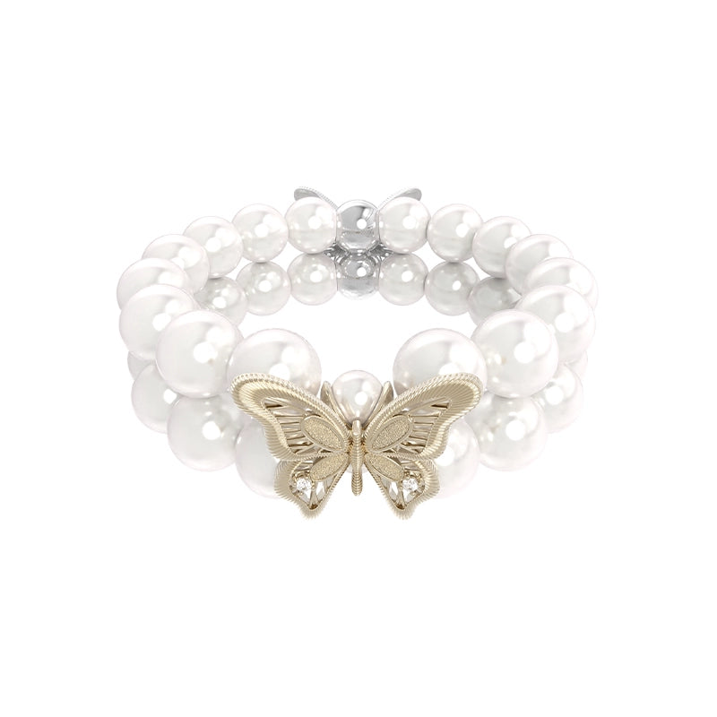 Lace butterfly pearl bracelet featuring a delicate gold butterfly charm and lustrous pearl beads