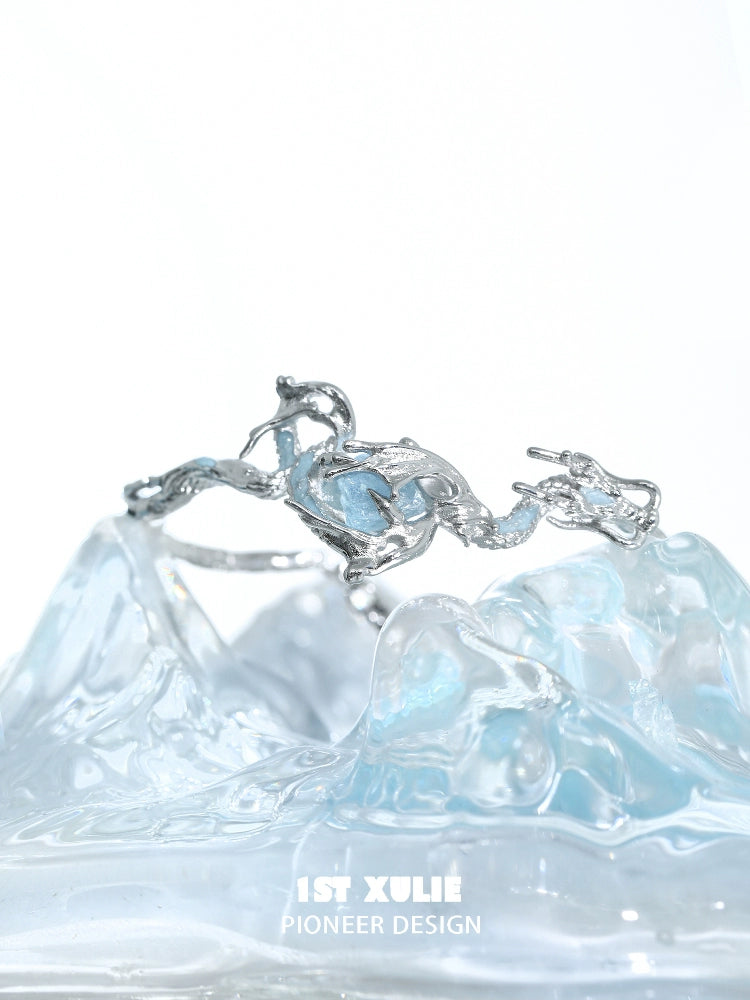 Ocean dragon king sapphire bracelet with intricate silver design and a blue gemstone centerpiece