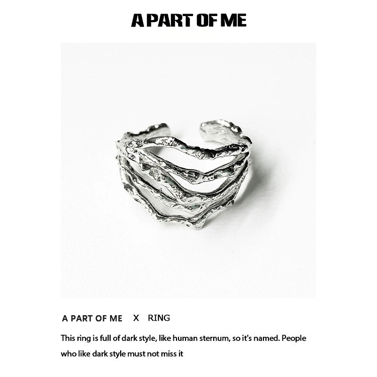 Bone minimalist ring from A PART OF ME featuring a dark, textured design resembling human sternum