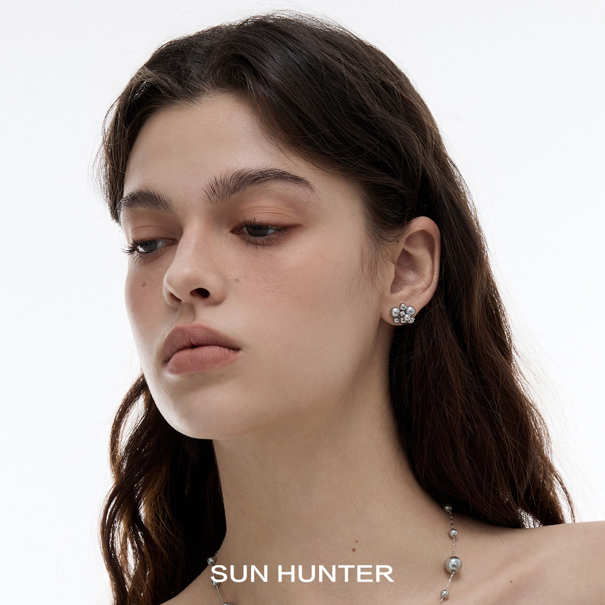 Elegant pearl zircon statement earrings by SUN HUNTER, perfect for adding a chic touch to any outfit