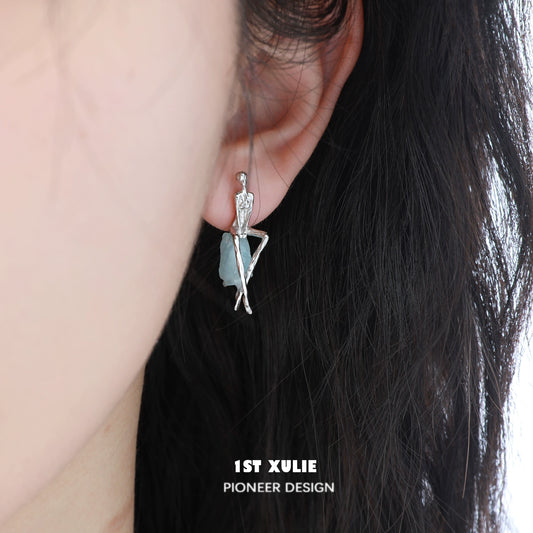 Y2K modern muse stud earrings with a unique design featuring a stylish figure and leaf details