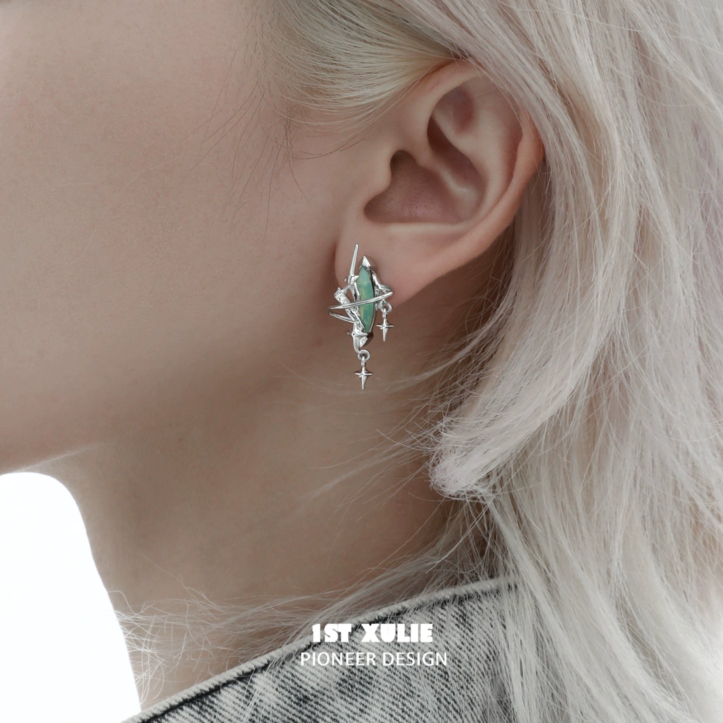 Y2K mystic earrings featuring a unique design with green gemstones and silver accents