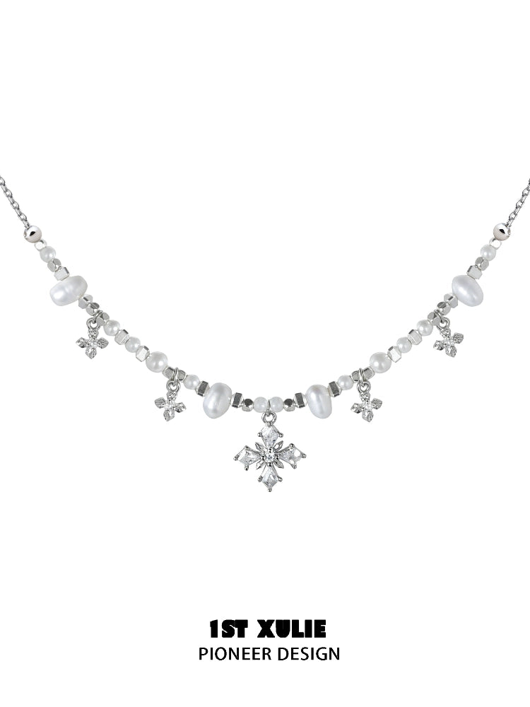 Y2K pearl necklace with silver accents and sparkling gemstones for a vintage-inspired look