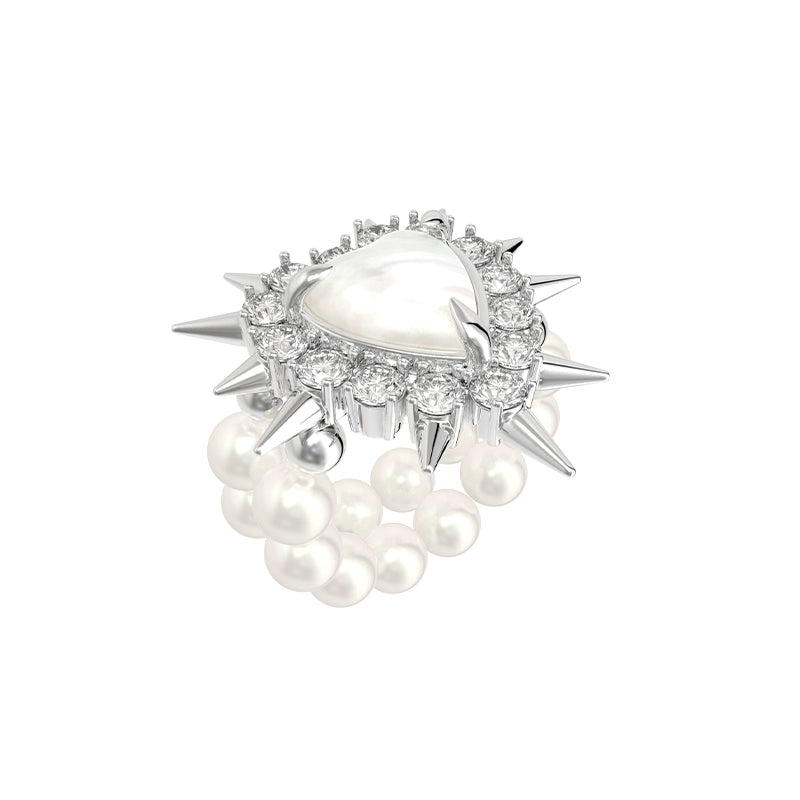 SUN HUNTER Y2K pearl rivet ring featuring a heart-shaped stone and spiked accents