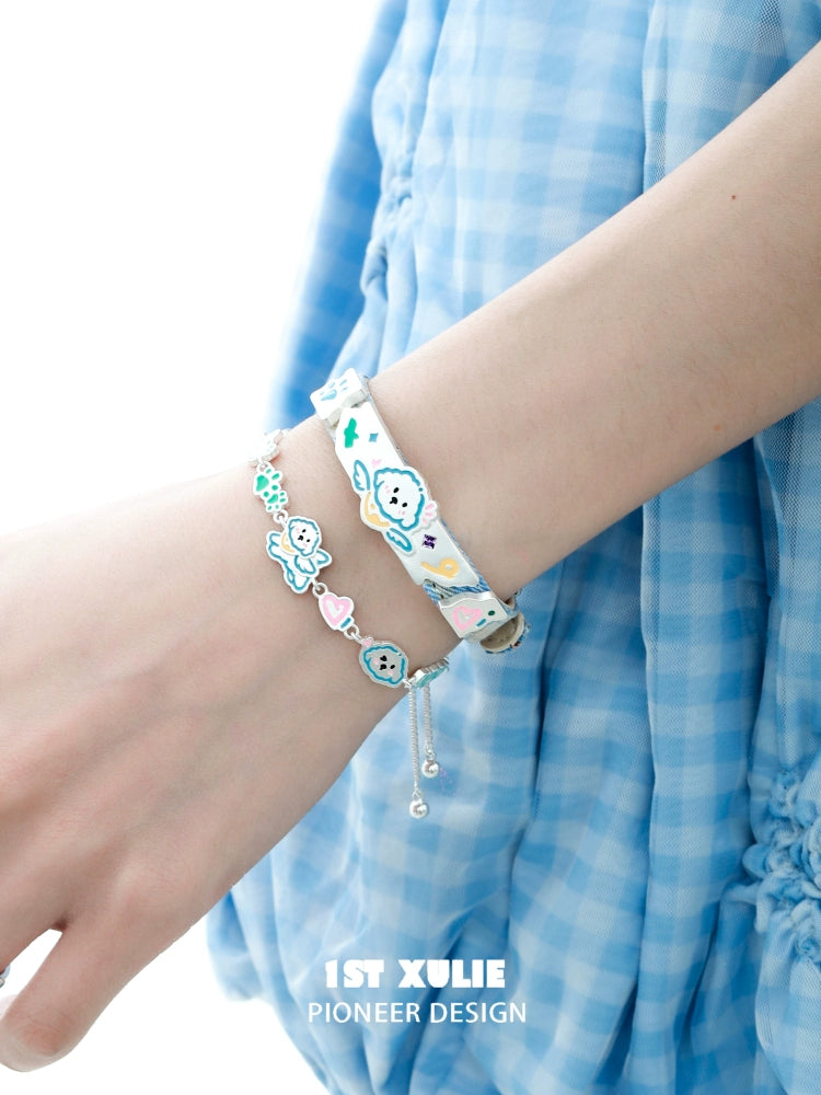 Colorful angel cat and puppy bracelet on a wrist, perfect for animal lovers and cute accessory enthusiasts.