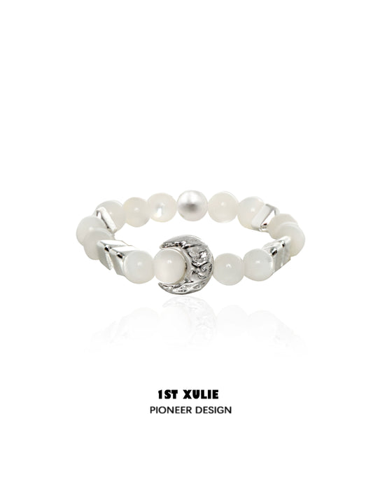 Beaded shell pearl silver ring from 1STXULIE featuring elegant design and unique texture.