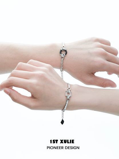 Stylish black and white couple bracelet featuring intertwined design for couples