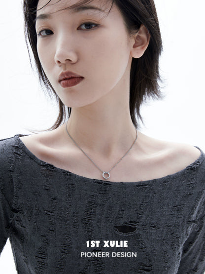 Model wearing a black and white gothic necklace, showcasing a unique and stylish design
