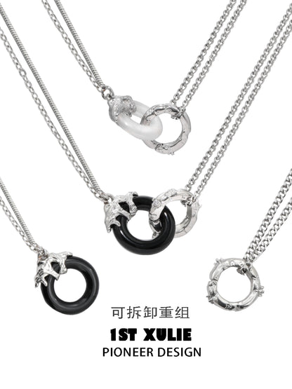 1ST XULIE black and white gothic necklace featuring interlocking rings and chain details