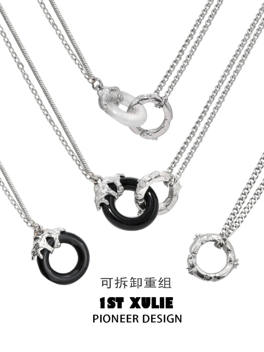 1ST XULIE black and white gothic necklace featuring interlocking rings and chain details