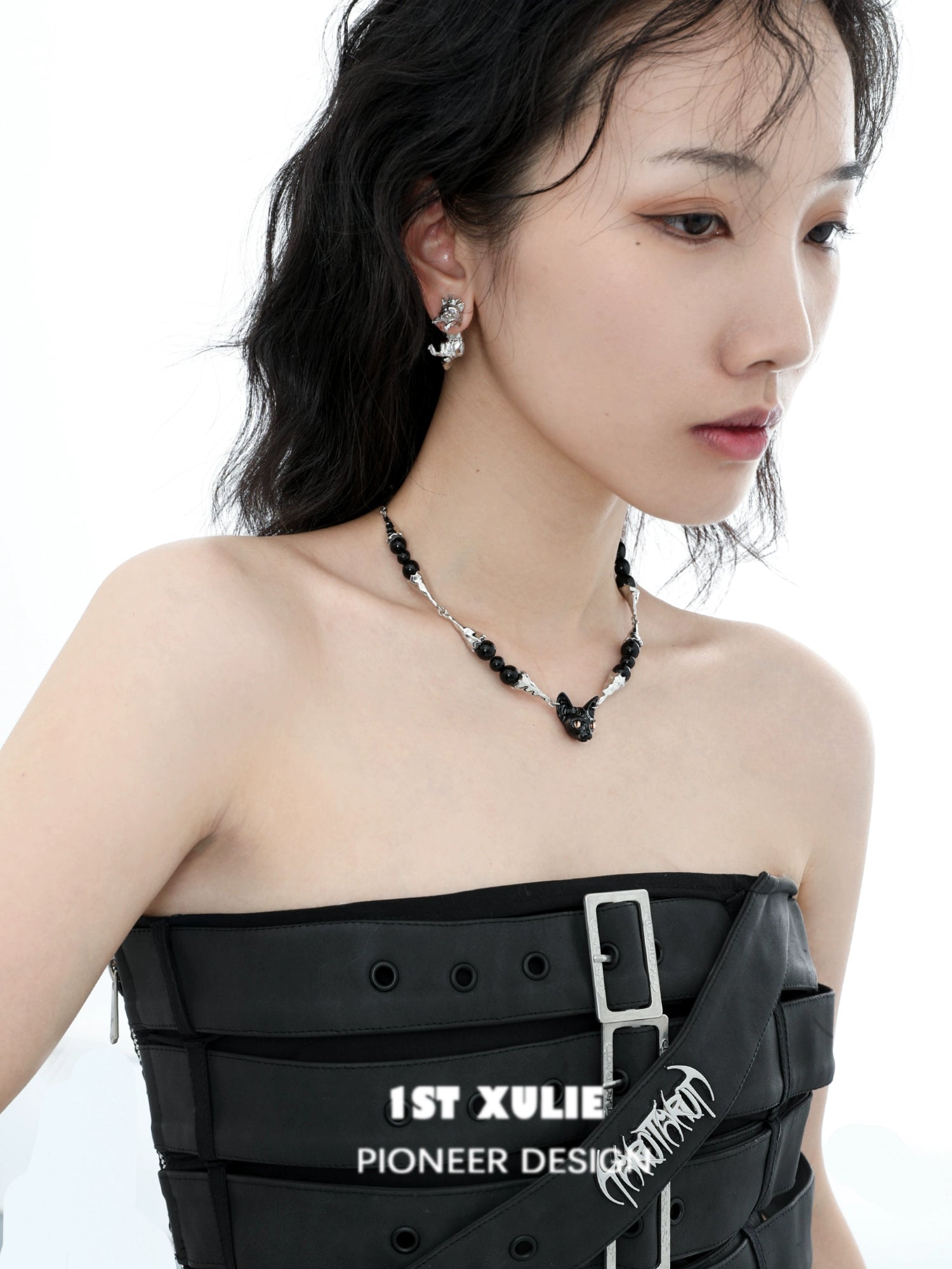 Stylish black cat necklace by 1ST XULIE paired with matching earrings, showcasing a unique design
