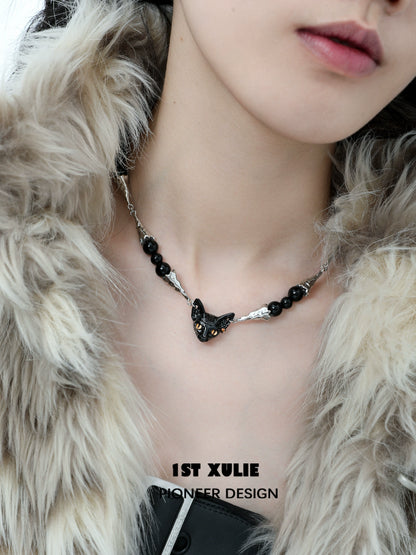 Stylish black cat necklace featuring a sleek design with black beads and a cat-shaped pendant