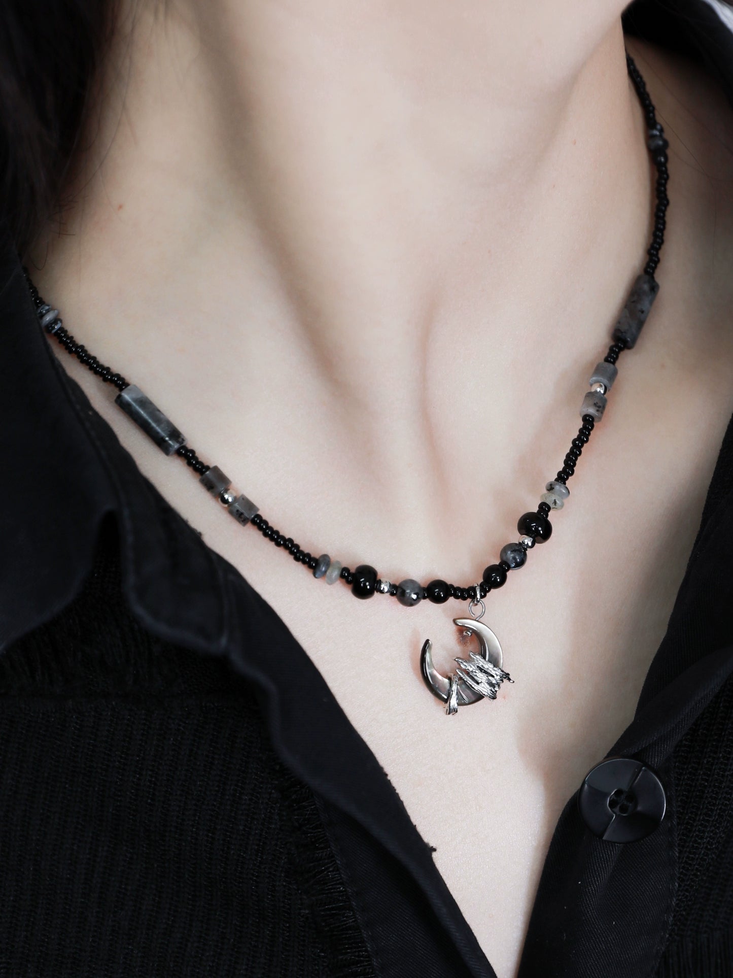 Layered black moon agate necklace with silver dragon pendant and assorted beaded design