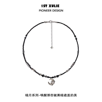Black moon agate necklace featuring unique beads and a stylish charm for elegant looks
