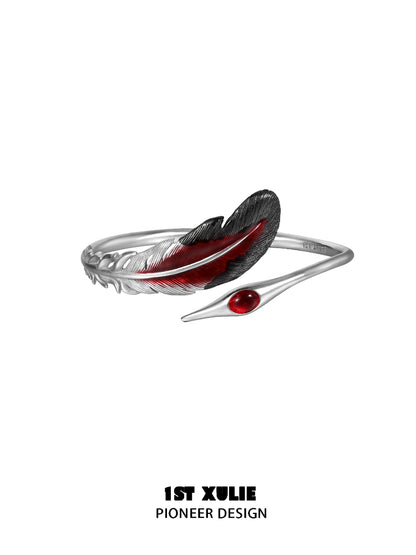 1STXULIE bloody feather bracelet with a silver base and red enamel detailing