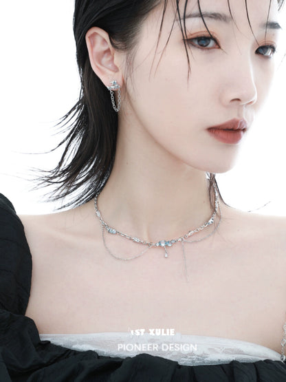 Elegant blue fringe zircon necklace showcased on model, enhancing her stylish look