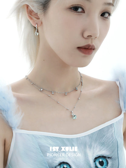 Elegant blue kitten hoop earrings showcased on a model with a unique style