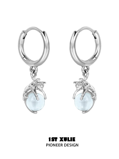 Silver blue kitten hoop earrings featuring playful kitten design and light blue beads