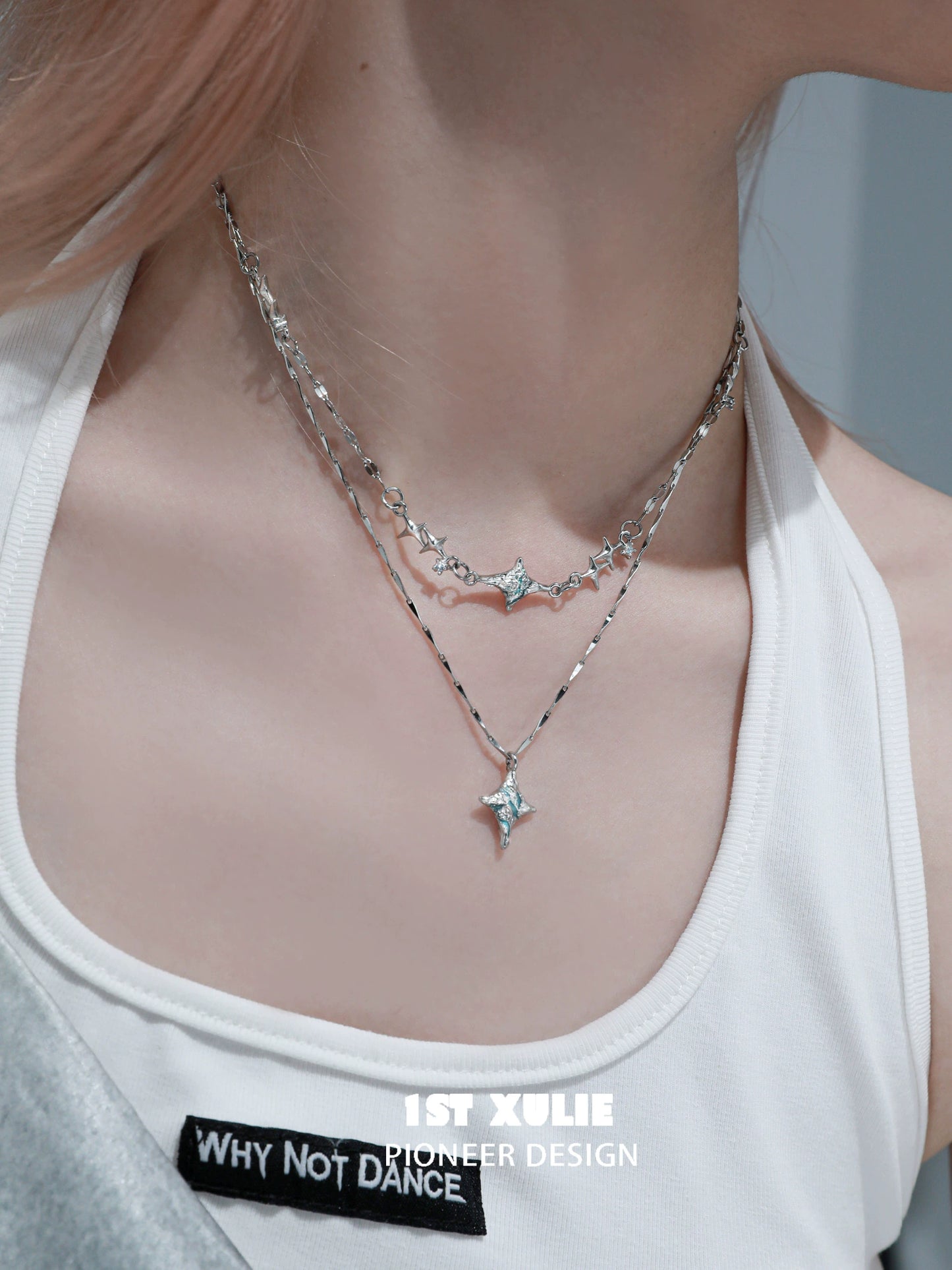 Layered silver necklaces featuring a blue starry sky necklace for a trendy look