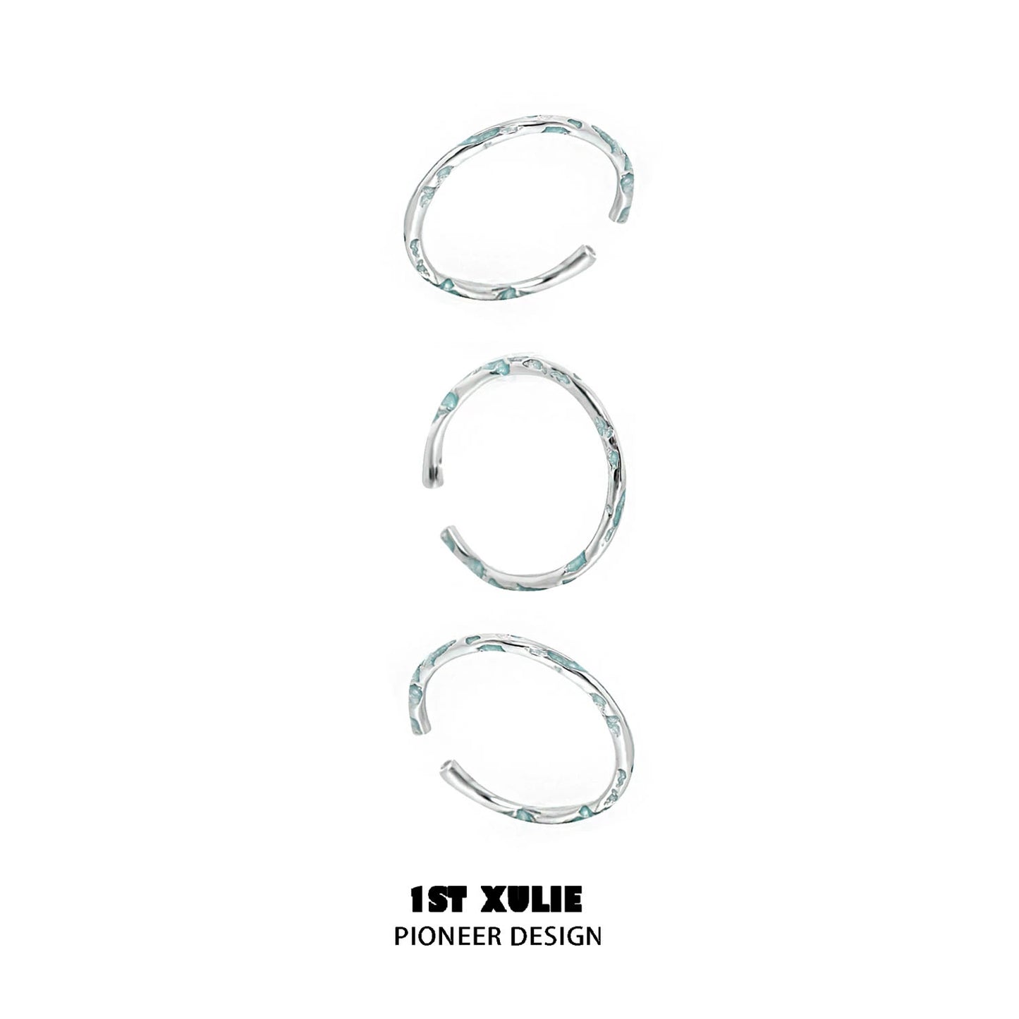 Set of three unique rings featuring a blue textured silver ring design for stylish layering