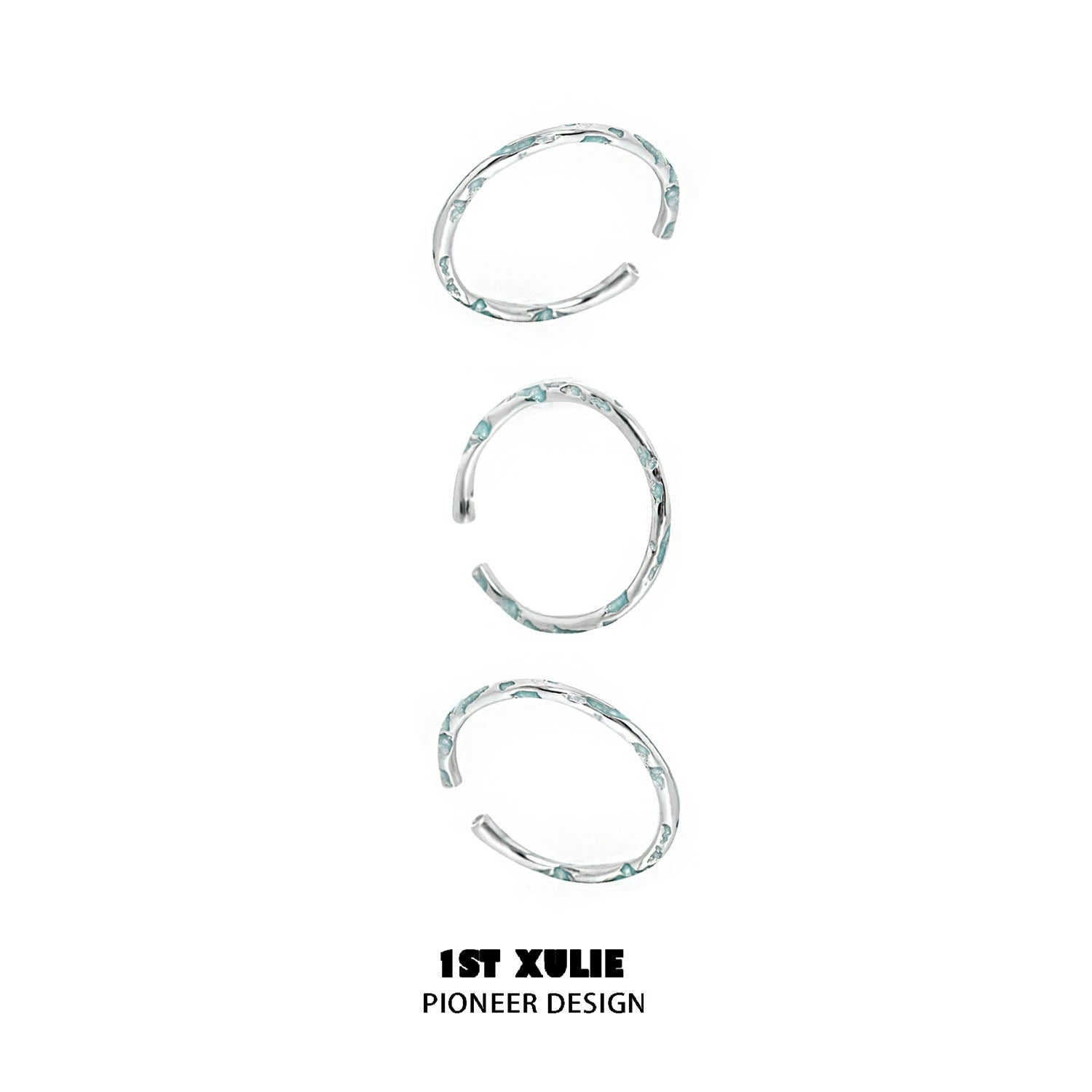 Set of three unique rings featuring a blue textured silver ring design for stylish layering