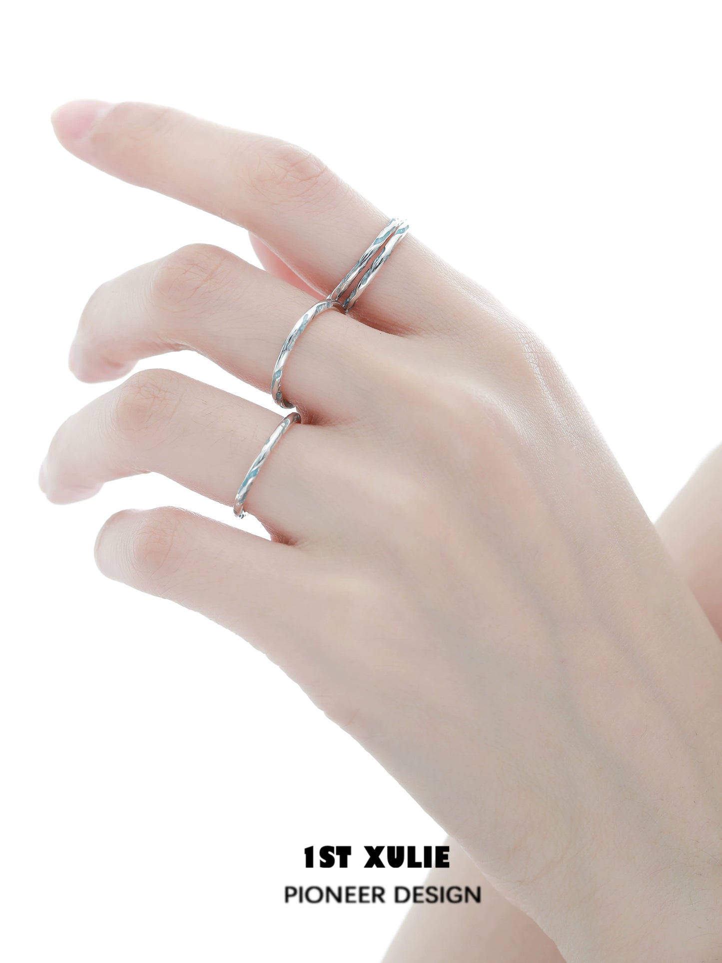 Stylish blue textured silver ring worn on a hand showcasing its unique design