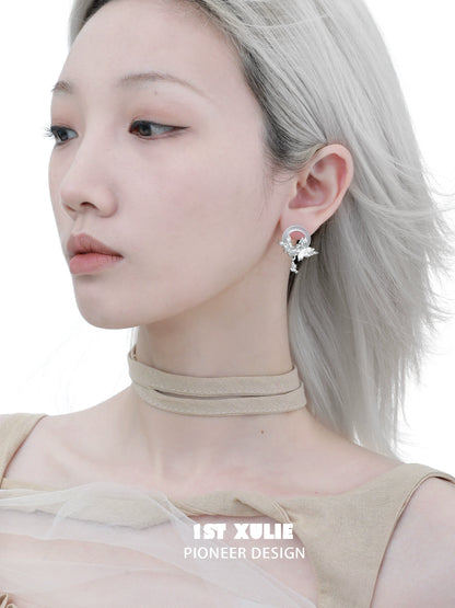 Elegant butterfly chalcedony earrings showcased on model with stylish accessories
