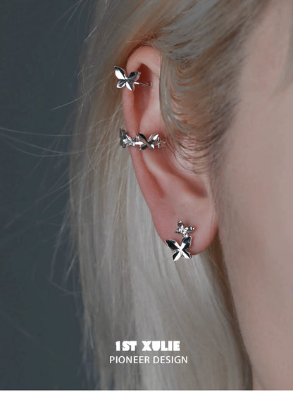 Stylish butterfly silver ear cuff featuring multiple butterfly designs for a trendy ear accessory