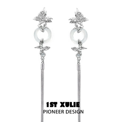 Elegant butterfly tassel earrings with silver accents and stylish design by 1ST XULIE