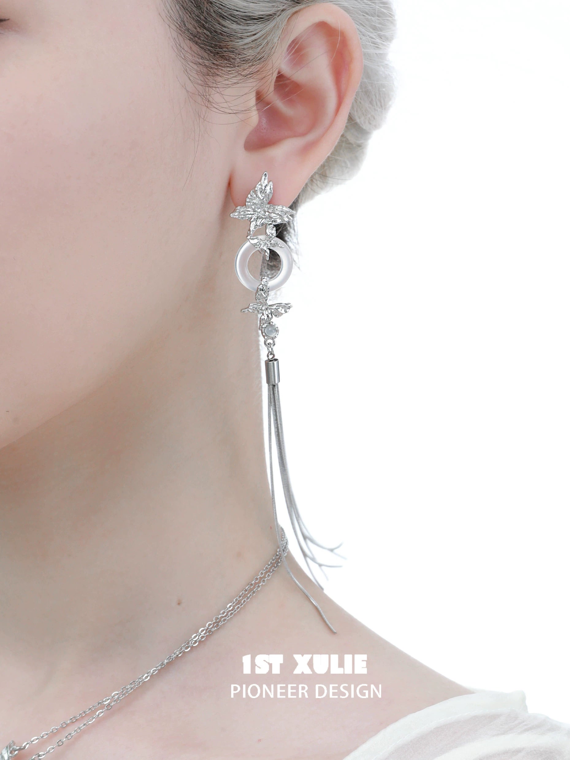 Elegant silver butterfly tassel earrings with intricate design and long dangling chain for a stylish look
