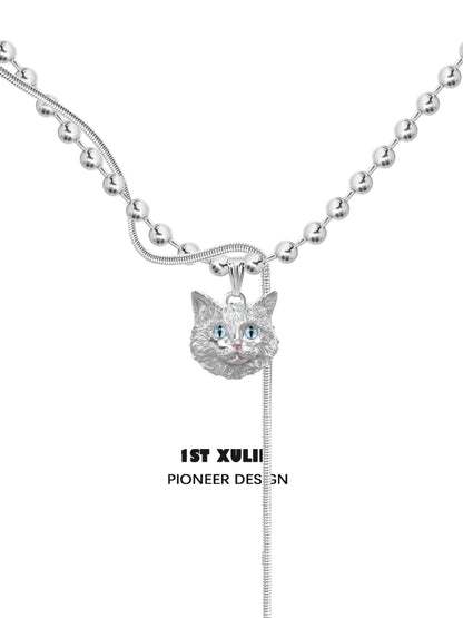 1STXULIE Cat Crown Necklace featuring a silver cat pendant with blue eyes on a beaded chain