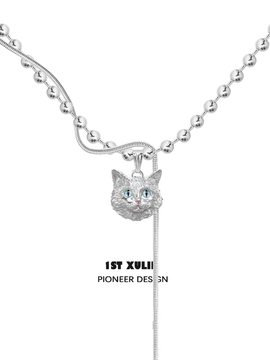 1STXULIE Cat Crown Necklace featuring a silver cat pendant with blue eyes on a beaded chain