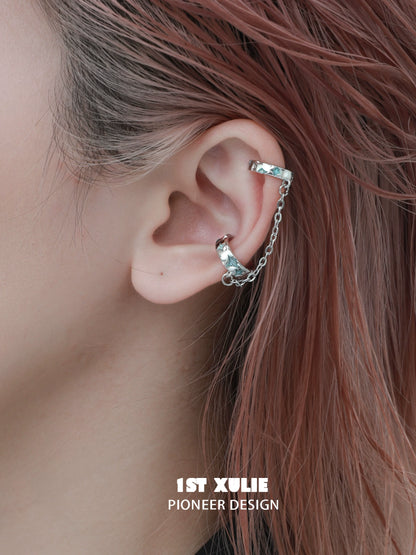 1ST XULIE Celestial ear cuff with chain design adorning the ear for a trendy look